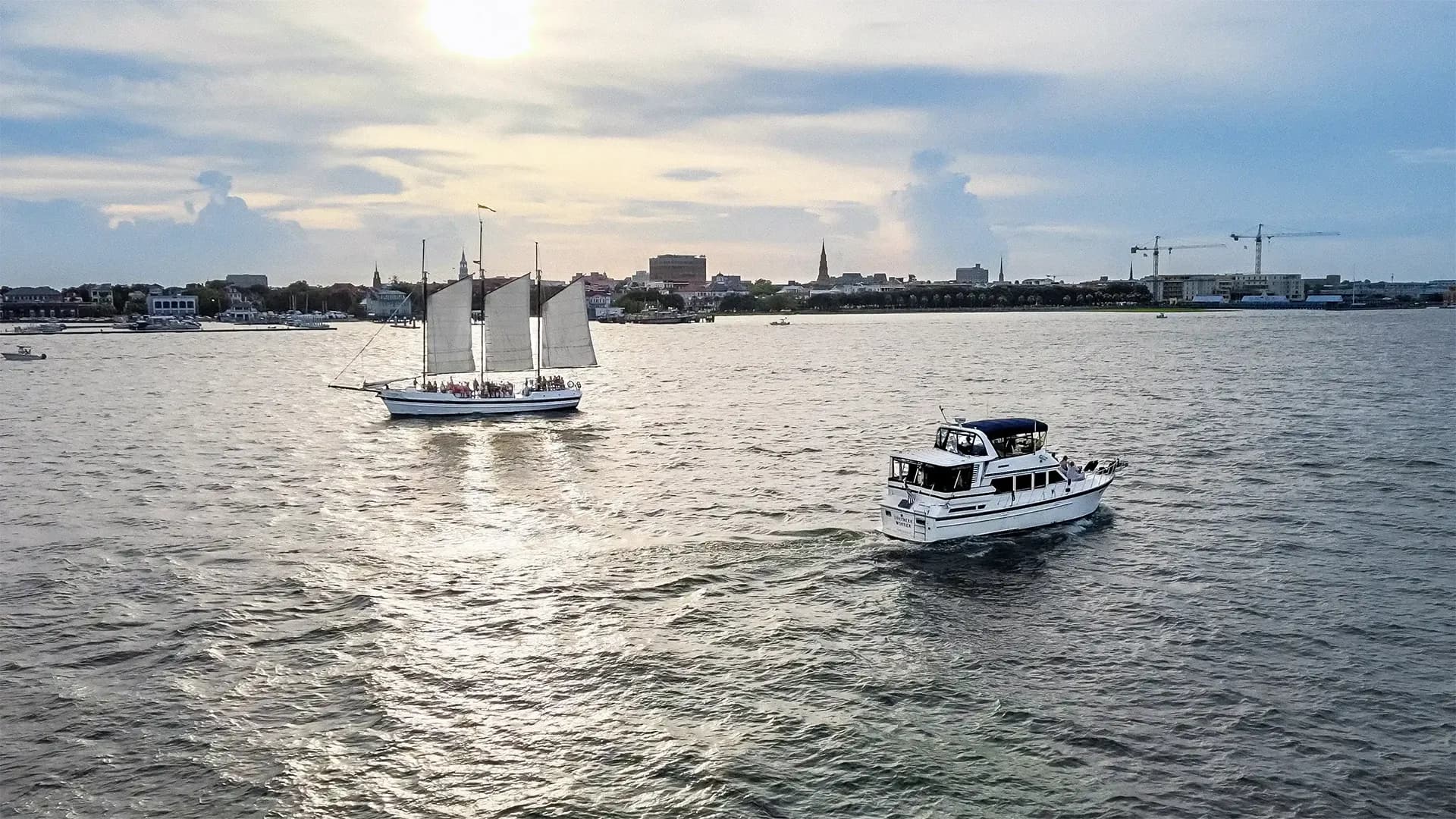 Southern Wonder yacht with Charleston Harbor scenery