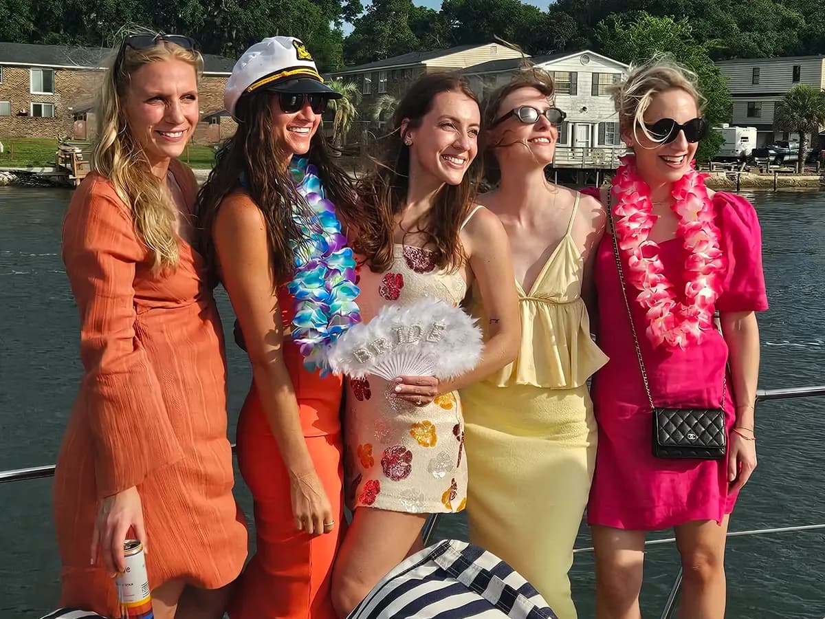 Happy guests posing during a Charleston yacht charter